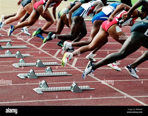 Group of runners leaving the starting blocks Stock Photo: 31602113 - Alamy