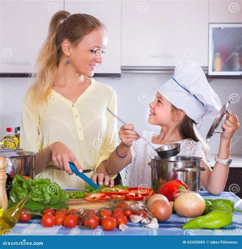 Mother With Daughter Cooking Veggies Stock Image Image Of Cuisine