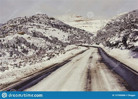 Snow Covered Road Through Rocky Mountain Of Colorado Usa Stock Photo