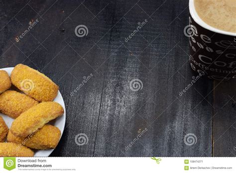 Morning Coffee With Milk And Cookies On A Dark Table Stock Image