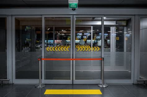 Emergency Exit Door In Airport Terminal With Access To Restricteed