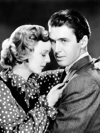 An Old Photo Of A Man And Woman Embracing Each Other With Polka Dots On