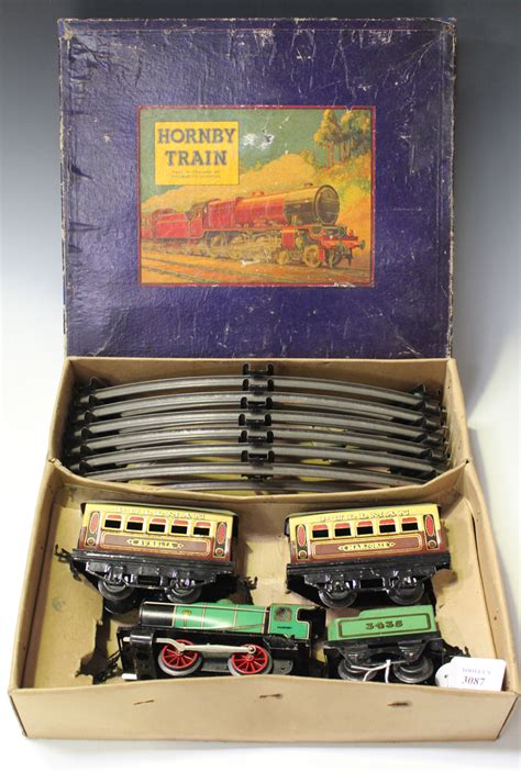 A Hornby Gauge O M1 Clockwork Passenger Train Set Comprising 0 4 0