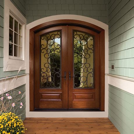 The 9 panel wide windows on each door welcome in more natural light to your home while still protecting you from the elements. Home Depot Double Doors | PJ Fitzpatrick