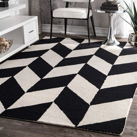 Get creative and place a black and white doormat on the front doorstep, and arrange an indoor rug with an inverted pattern in the same color scheme. Shop nuLOOM Handmade Mod Tiles Wool Black and White Rug (5 ...