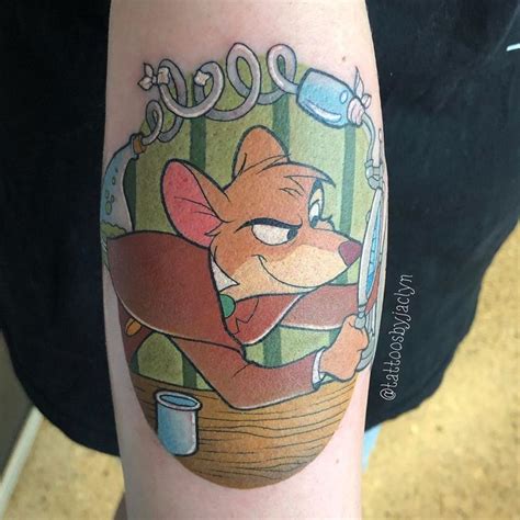 A Cartoon Tattoo On The Arm Of A Person With A Mouse Holding A Toothbrush