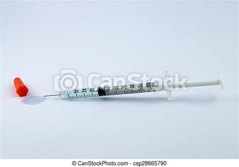 Small Syringe With Blue Fluid Canstock