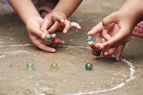 Kids Playing Marbles Stock Photos Pictures And Royalty Free Images Istock