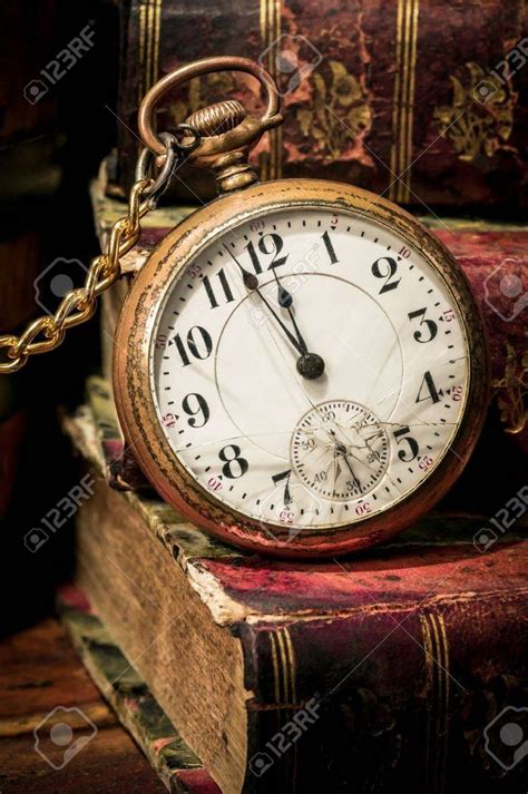 Antique Pocket Clock Showing A Few Minutes To Midnight Over Ancient