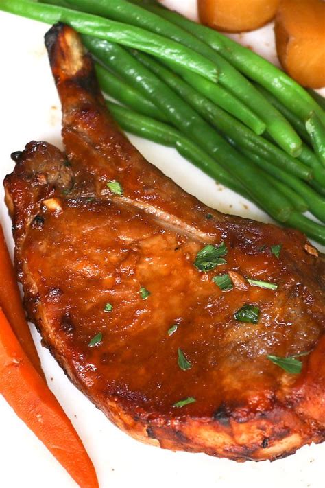Cook pork chops until they're browned on instant pot pork chops cooking tips: Instant pot bone-in pork chops served on a white plate with carrots and green beans. | Instant ...
