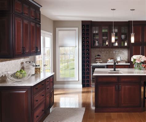 Adding glass inserts offers a bright, airy, modern feel. Dark Cherry Kitchen with Glass Cabinet Doors - Decora