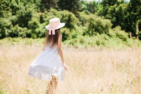 Little Girl In A Hat On A Golden Meadow Stock Image Image Of Golden