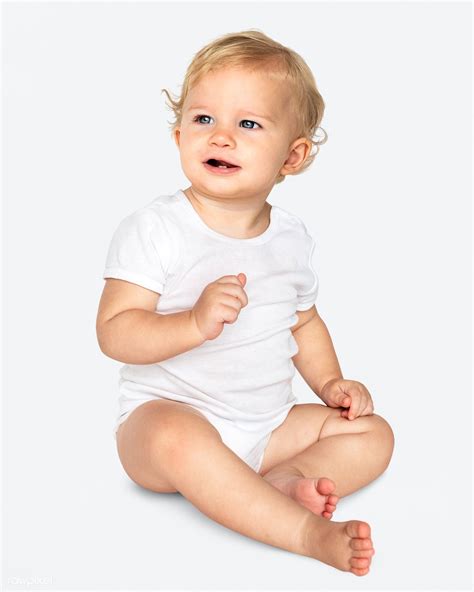 Baby Sitting On The Floor In A Studio Premium Image By