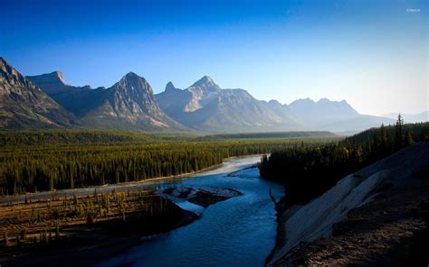 Subsequent erosion by glaciers has created. Clear blue sky above the rocky mountain peaks wallpaper - Nature wallpapers - #49647