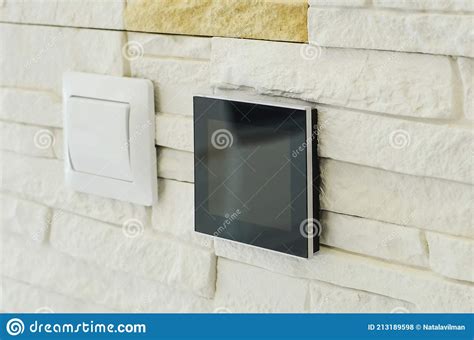Modern Electrical Switch On The Wall With Decorative Plaster Close Up