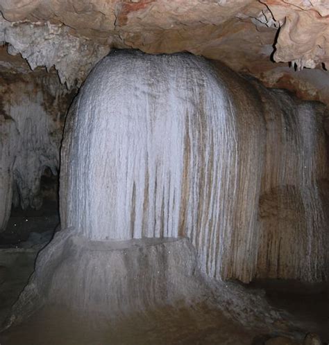A Formation Of A Waterfall Inside The Cave Photo
