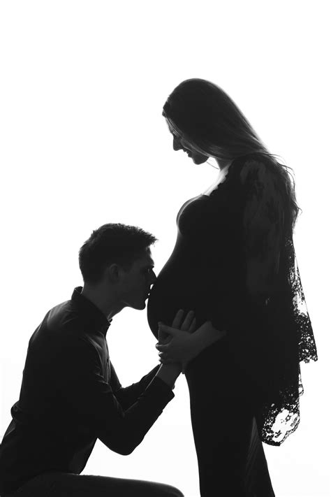 Black And White Silhouette Of Couple Expecting Mom To Be Belly Shot And Maternity Pictures