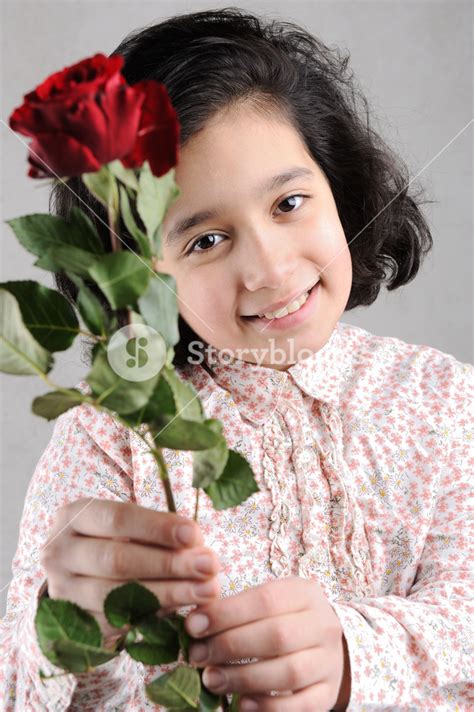 Lovely Person Holding A Stunning Red Rose Royalty Free Stock Image