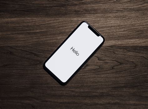 Black Iphone 7 On Brown Table · Free Stock Photo