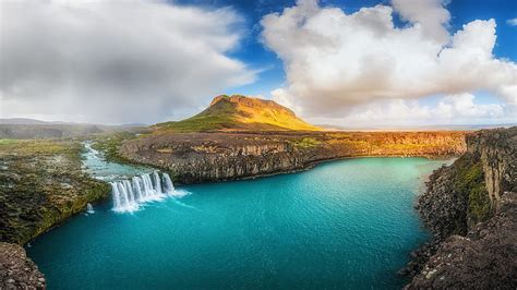 Landscape View Of Greenery Mountain Waterfalls Pouring On River Rocks