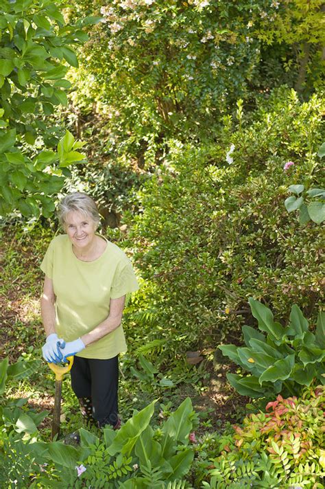 Older Woman Gardening In Backyard Stock Image F0044758 Science