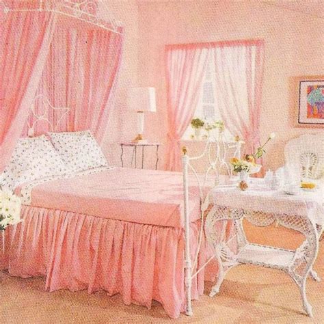 A Bedroom With Pink Bedding And Curtains White Furniture And Flowers