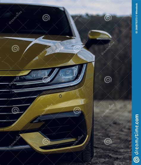 Vertical Shot Of A Volkswagen Arteon Gold Color Editorial Stock Photo