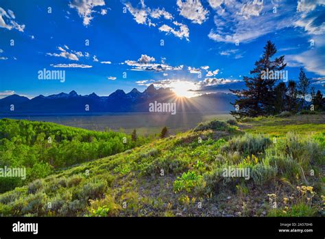 Sunset Over The Grand Teton Mountain Range Stock Photo Alamy