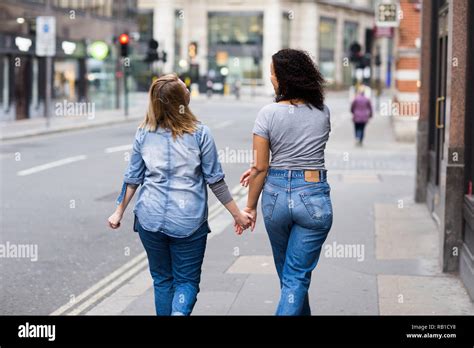 Lesbian Couple Walking Together Holding Hands Stock Photo Alamy