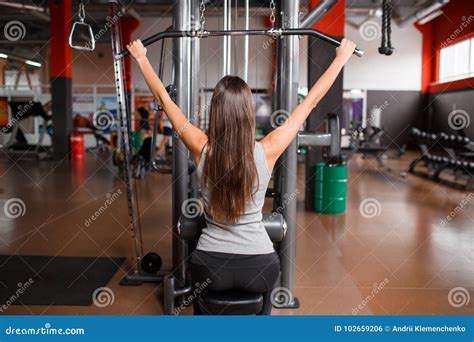A Girl In The Gym Pumps Her Back Muscles Stock Photo Image Of