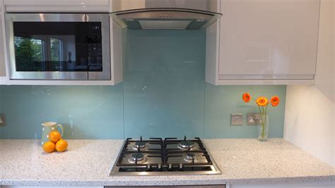 Blue Kitchen Glass Splashback Behind Gas Hob See Built In Microwave White Quartz Kitchen