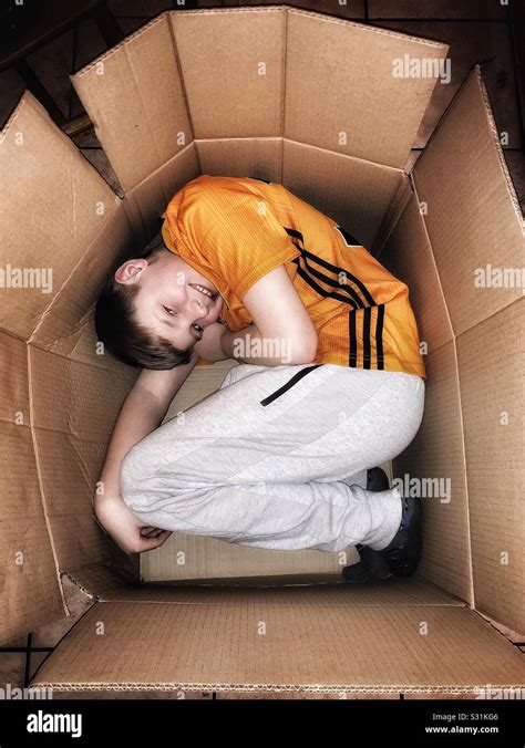 Boy In A Box Stock Photo Alamy