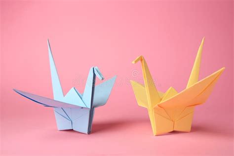 Origami Art Colorful Handmade Paper Cranes On Pink Background Stock