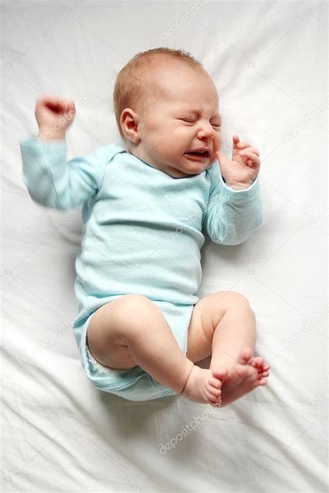 Sweet Newborn Baby Crying In Crib — Stock Photo © Christin