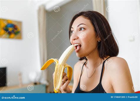 Eating Banana In Her Apartment Stock Image Image Of House Female