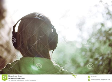 Woman In Headphones Against Bright Sunlight Stock Photo Image Of