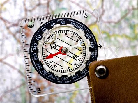 A Clear Plastic Compass Over A Map Stock Image Colourbox