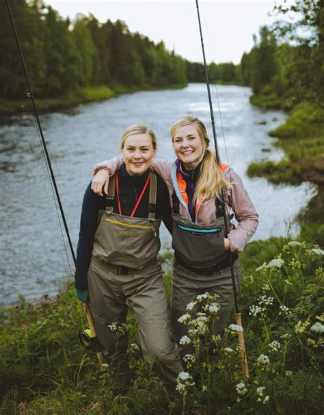 Two Happy Women Salmon Fly Fishing In Tornio Torne River In Pello In