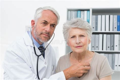 Doctor Checking Patients Heartbeat Using Stethoscope Stock Image Image Of Senior Elderly