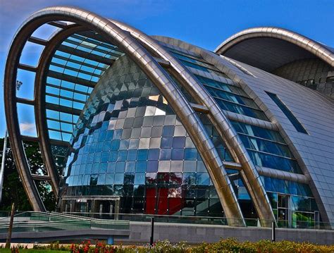 An Unusual Building With Large Curved Windows On The Outside