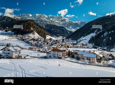 Winter View Of Selva Di Val Gardena With Sella Massif Behind Dolomites