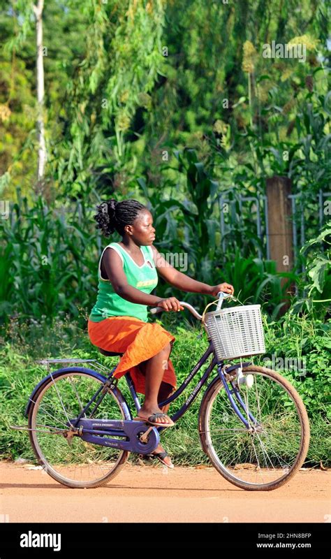 A Burkinabe Woman Riding Her Bicycle In Ouagadougou Burkina Faso Stock