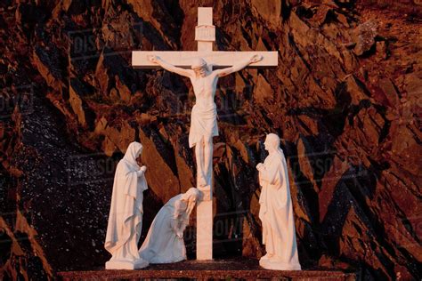 Statues Of Jesus Christ On The Cross And Followers At The Foot Of The
