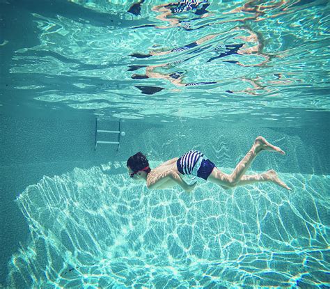 Underwater Image Of Boy Swimming In A Swimming Pool Photograph By