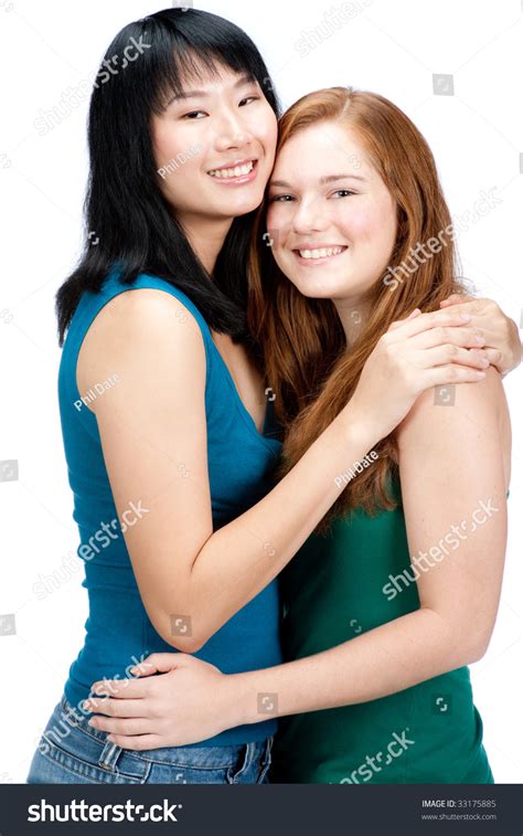 Asian Teenager Hugging Her Caucasian Friend Stock Photo 33175885