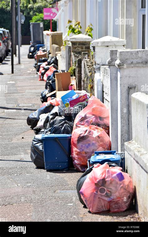 Street Scene Pavement Waste Management Applied To Terraced Houses With