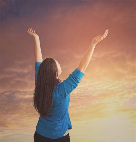 A Woman Lifts Her Arms Up In Praise Royalty Free Stock Image Storyblocks