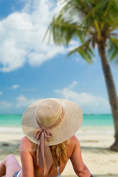 Woman In Bikini With Sunhat At The Beach Stock Photo By Netfalls Photodune