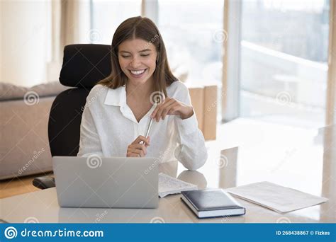 Happy Positive Young Adult Student Girl Watching Webinar On Laptop