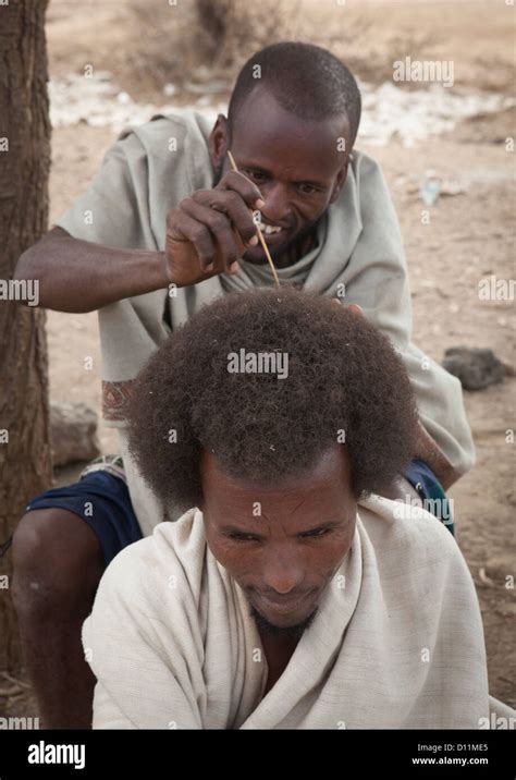 Karrayyu Tribe Man Having His Gunfura Traditional Hairstyle Done In